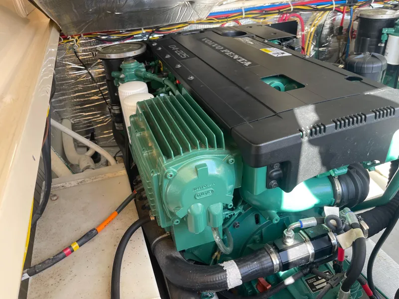 Slide: The Image of Engine compartment of a 2015 Fortier 30 boat, featuring a Volvo Penta engine. - 29