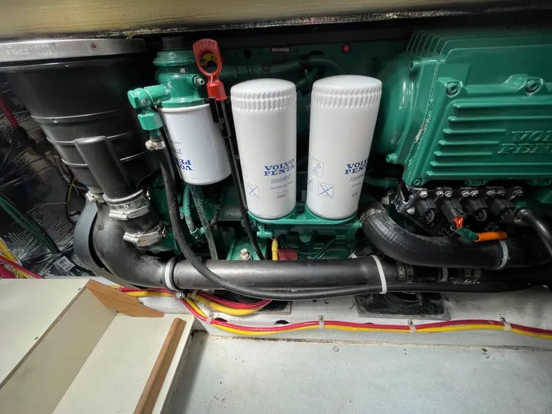 Slide: The Image of Engine compartment of a 2015 Fortier 30 boat, featuring Volvo Penta components. - 31
