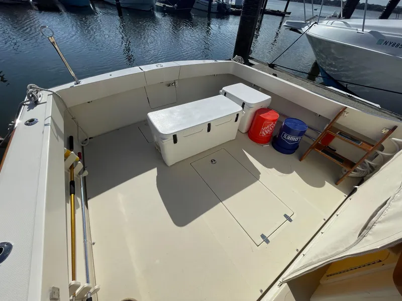 Slide: The Image of Spacious deck of 2015 Fortier 30 boat with storage and seating. - 37