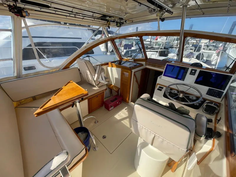 Slide: The Image of Interior of 2015 Fortier 30 boat with helm, seating, and navigation equipment. - 5