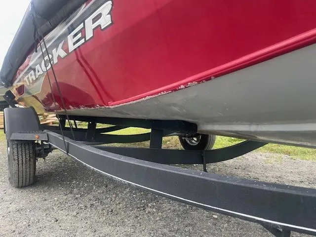 Slide: The Image of 2023 Tracker Pro Team 175 TXW boat on trailer, red and gray exterior. - 13