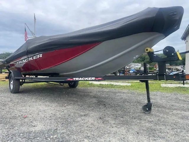 Slide: The Image of 2023 Tracker Pro Team 175 TXW boat on trailer, covered, parked outdoors. - 5
