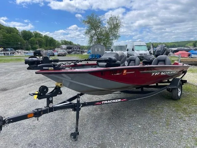 Slide: The Image of 2023 Tracker Pro Team 175 TXW boat on trailer, parked outdoors. - 8