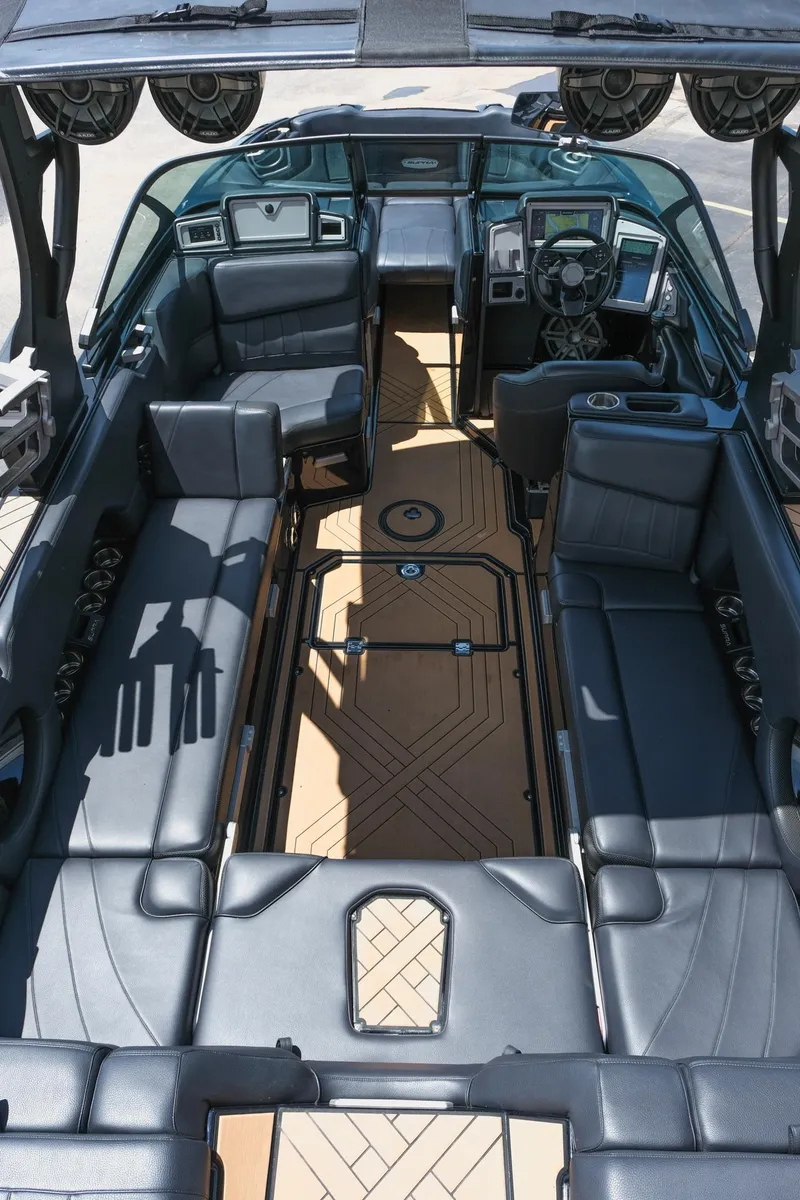 Slide: The Image of 2019 Supra SE450 boat interior with luxurious seating and modern dashboard. - 16