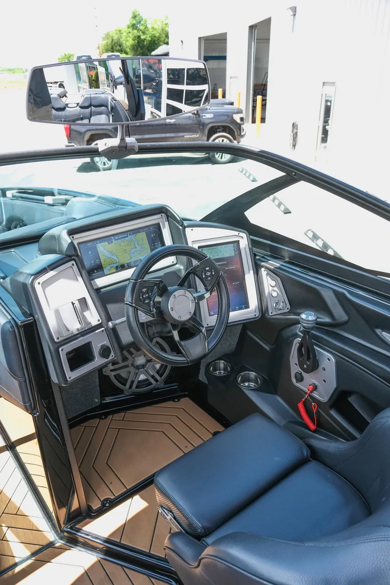 Slide: The Image of Interior of 2019 Supra SE450 boat with advanced navigation system and sleek design. - 20