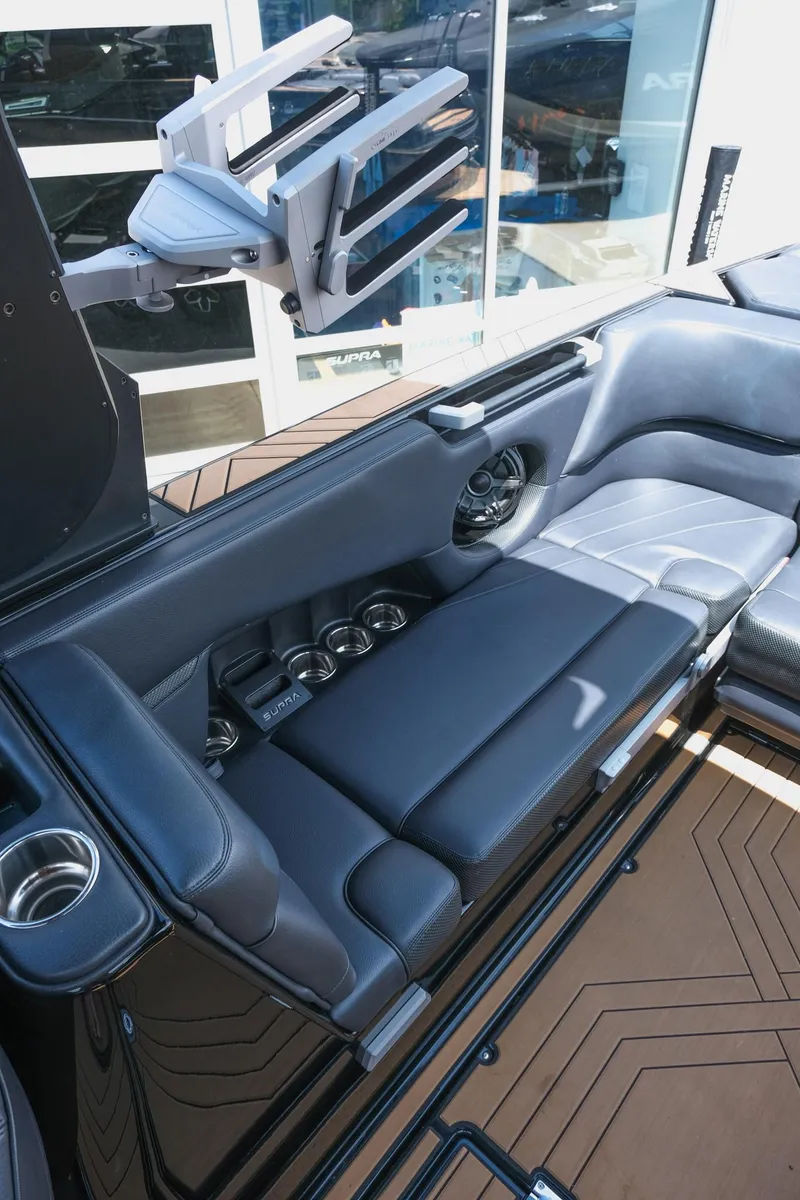 Slide: The Image of 2019 Supra SE450 interior with sleek black seating and modern design elements. - 22