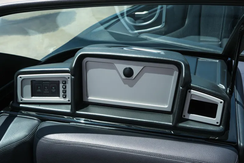 Slide: The Image of 2019 Supra SE450 dashboard with control panel and storage compartment. - 24