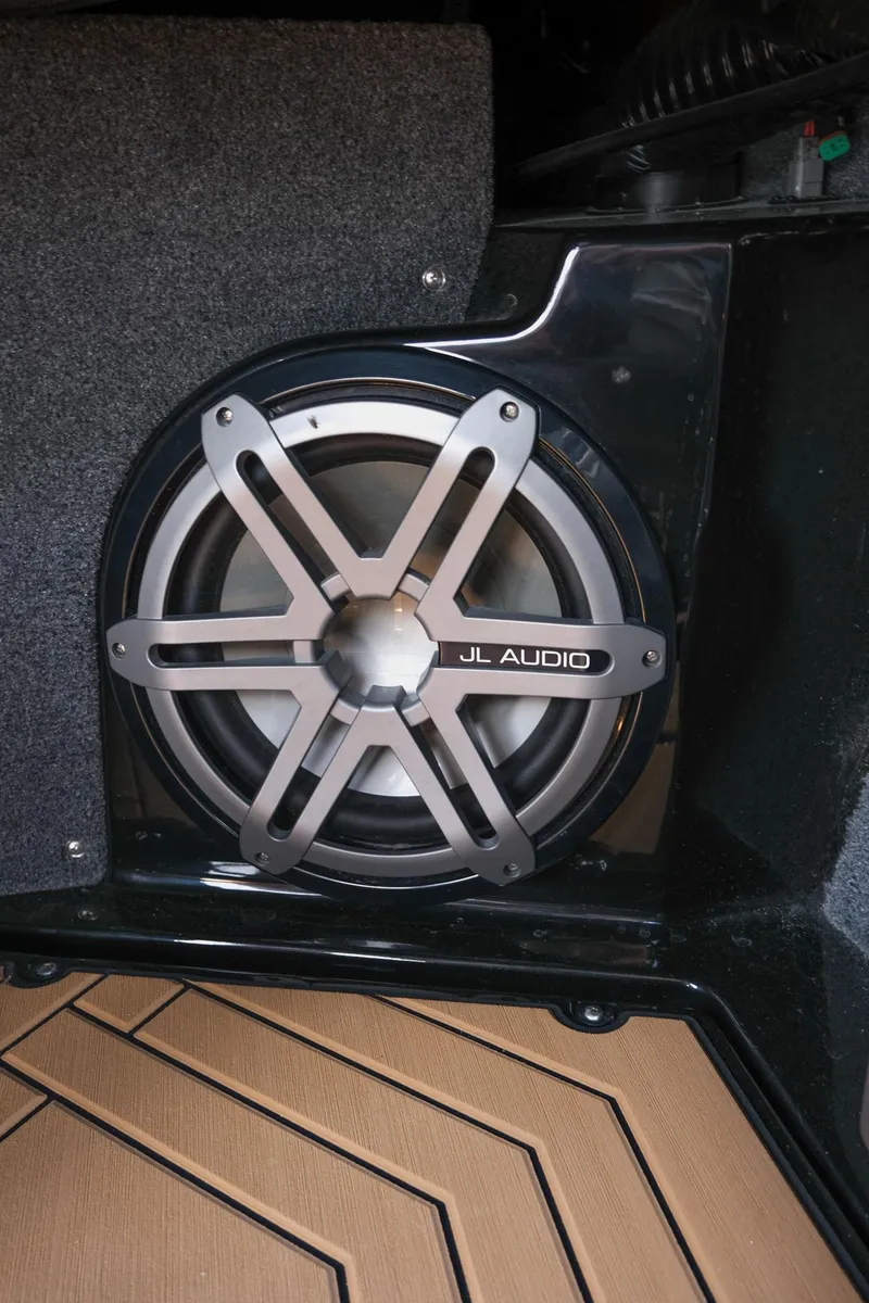 Slide: The Image of 2019 Supra SE450 JL Audio speaker in a sleek black and gray interior. - 27