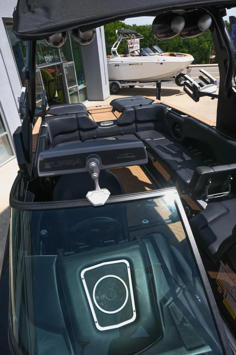 Slide: The Image of 2019 Supra SE450 boat interior with sleek design and advanced audio system. - 31