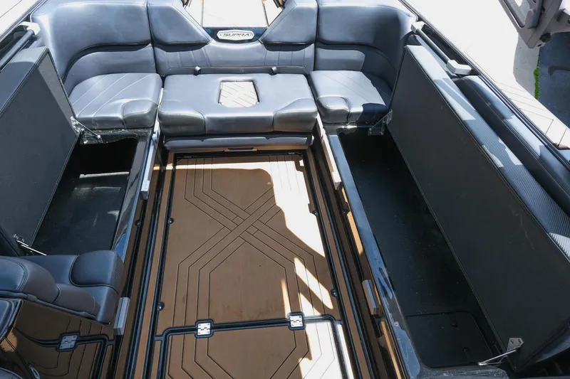 Slide: The Image of 2019 Supra SE450 boat interior with spacious seating and stylish flooring design. - 33