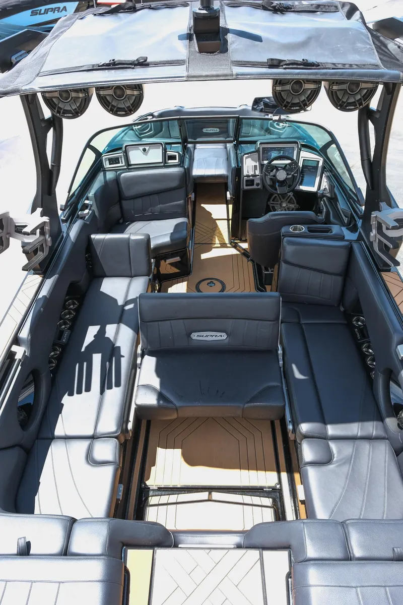 Slide: The Image of 2019 Supra SE450 boat interior with luxurious seating and advanced dashboard features. - 38