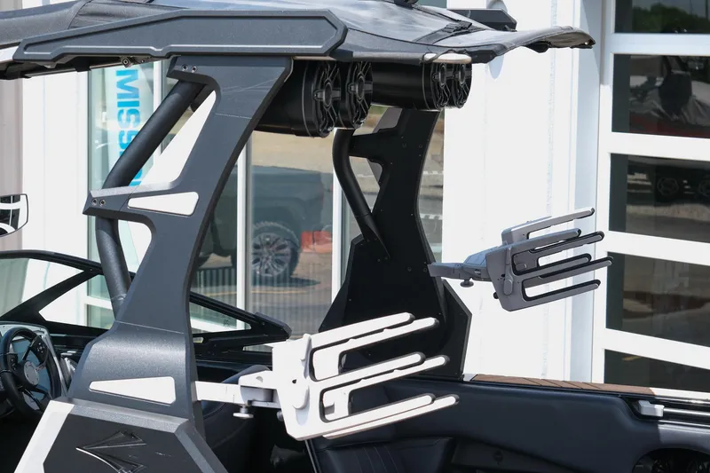 Slide: The Image of 2019 Supra SE450 boat with wakeboard racks and speakers. - 5