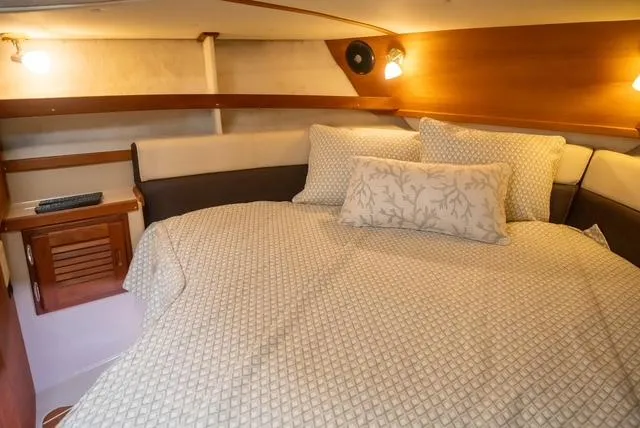 Slide: The Image of Cozy cabin interior of 2015 Ranger Tugs R-31 CB with comfortable bedding. - 7