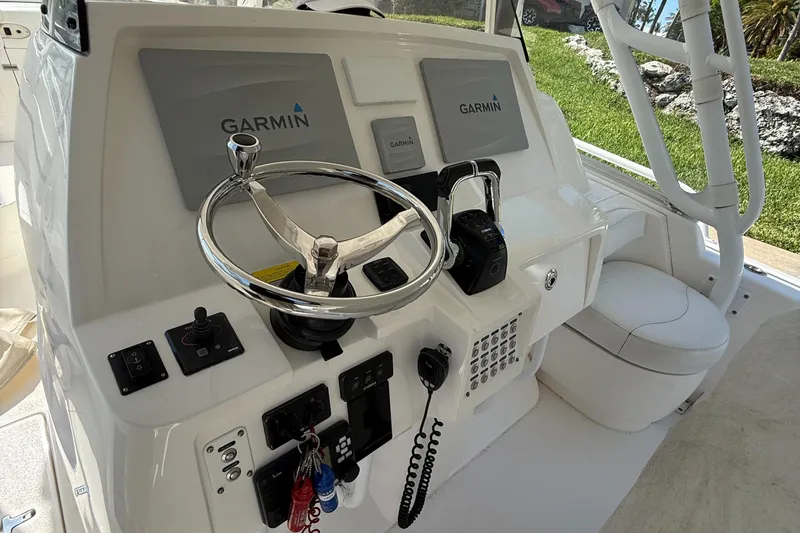 Slide: The Image of Control panel of a 2015 Intrepid 375 Walkaround boat with Garmin navigation. - 15