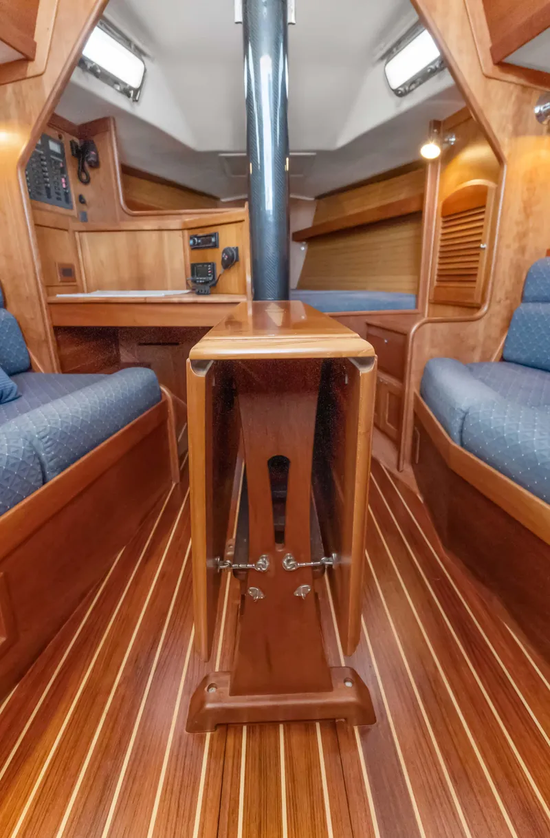 Slide: The Image of 2008 Sabre Spirit yacht interior with wooden flooring and seating. - 12
