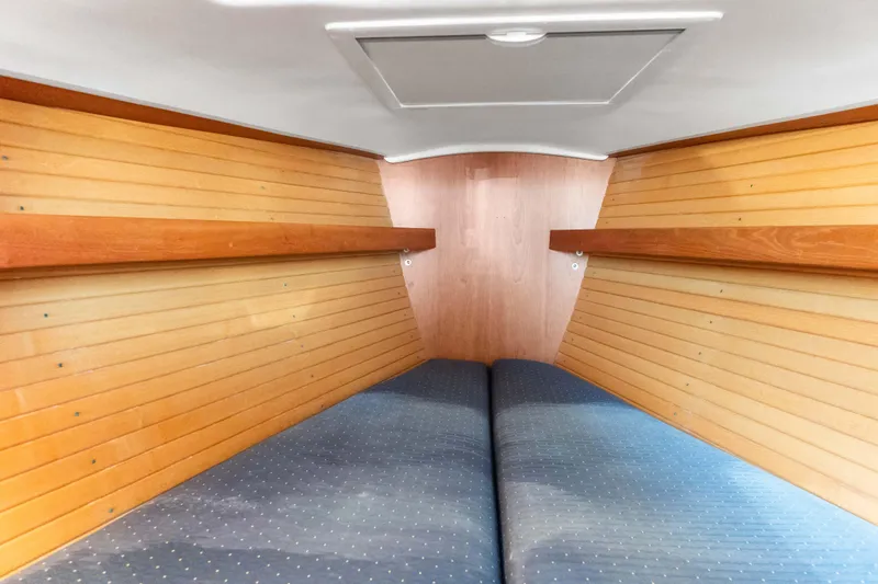 Slide: The Image of 2008 Sabre Spirit interior cabin with wooden paneling and cushioned seating. - 14