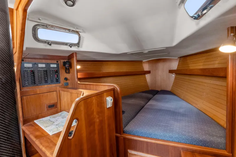 Slide: The Image of 2008 Sabre Spirit cabin interior with wooden finish and navigation panel. - 18