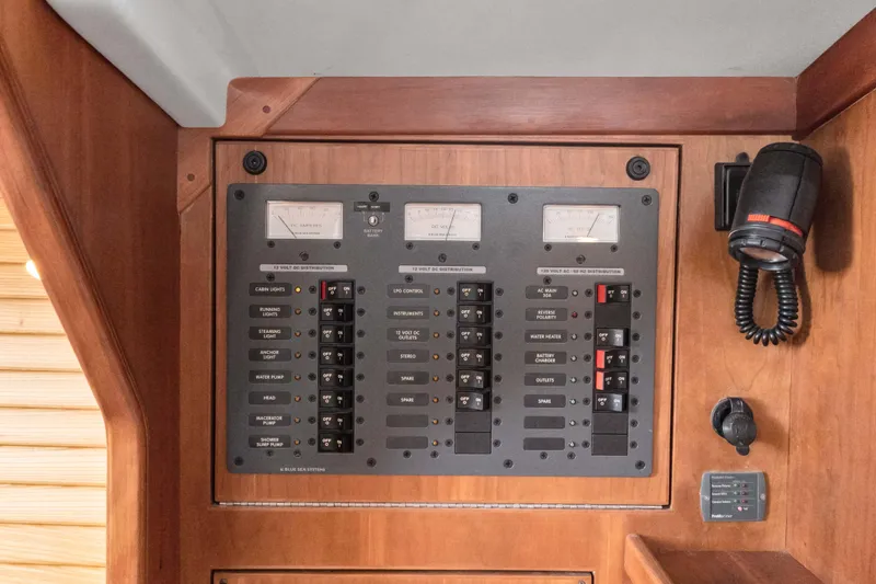Slide: The Image of Electrical control panel on 2008 Sabre Spirit boat, featuring switches and meters. - 19