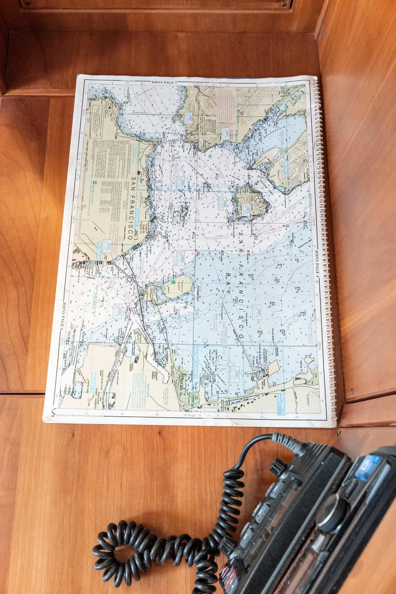 Slide: The Image of Nautical chart on wooden surface with radio, Sabre Spirit 2008. - 22