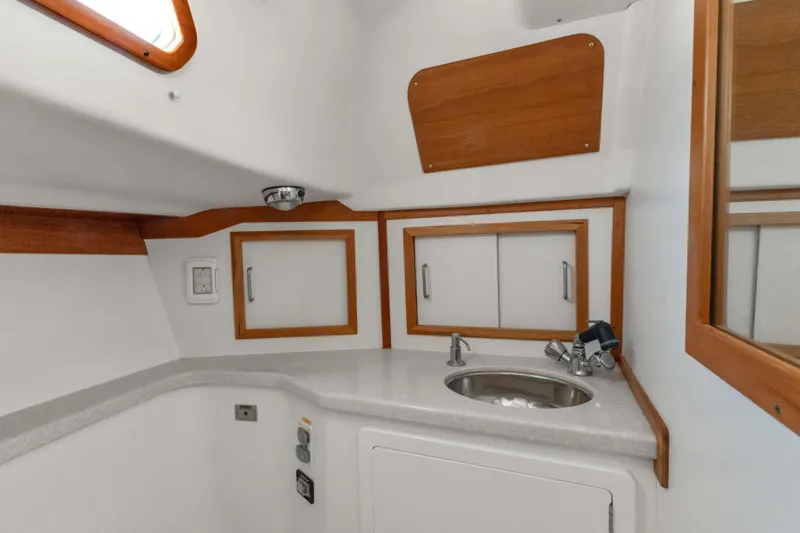 Slide: The Image of 2008 Sabre Spirit yacht interior with sink and wooden cabinetry. - 24