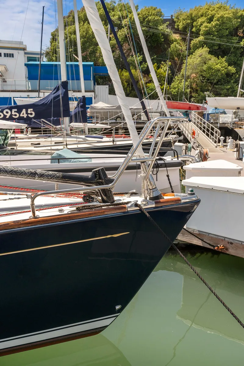 Slide: The Image of 2008 Sabre Spirit sailboat docked in a marina with lush greenery. - 32