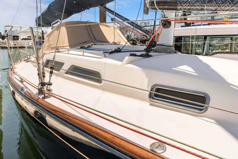 Slide: The Image of 2008 Sabre Spirit sailboat docked in marina, featuring sleek design and modern rigging. - 33