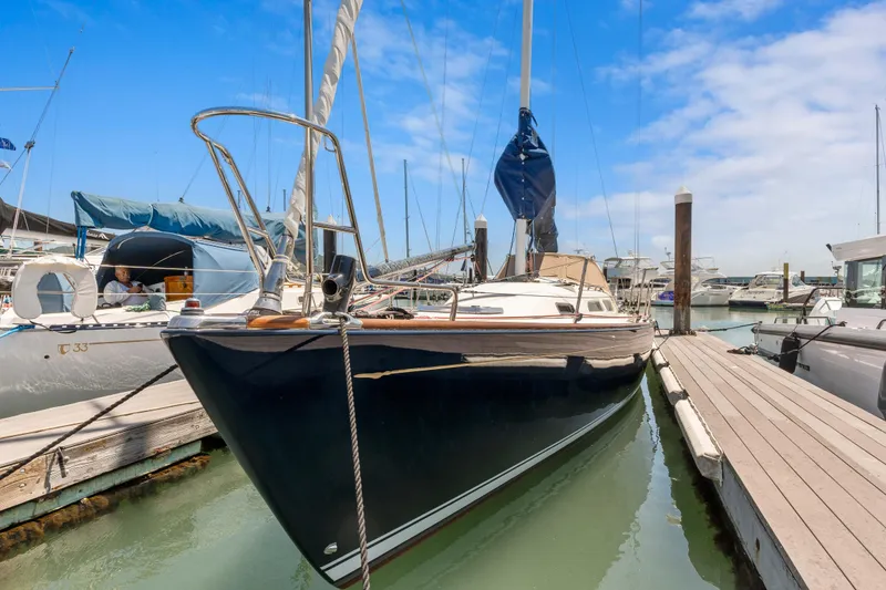 Slide: The Image of 2008 Sabre Spirit sailboat docked at marina under blue sky. - 34