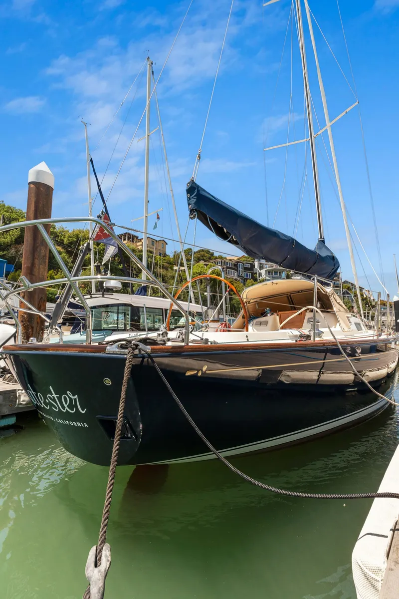 Slide: The Image of 2008 Sabre Spirit sailboat docked in marina under clear blue sky. - 36