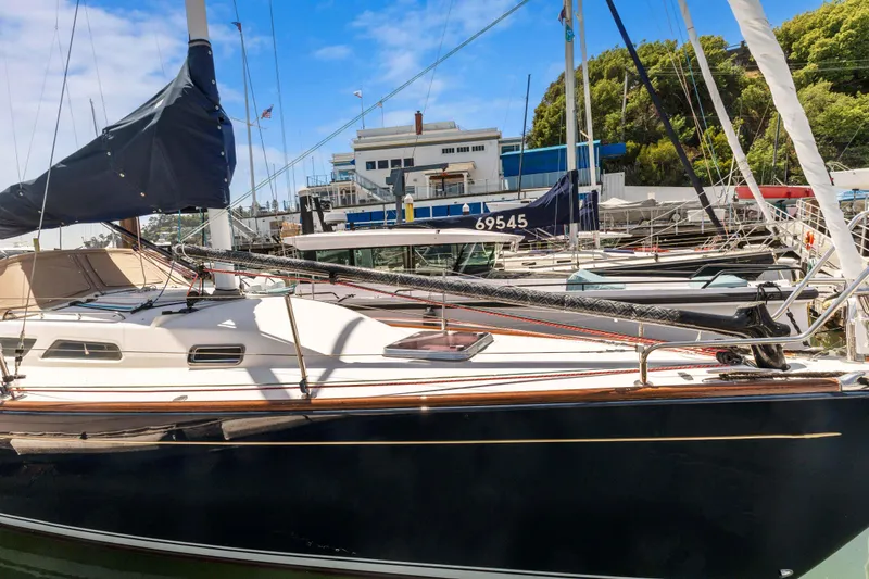 Slide: The Image of 2008 Sabre Spirit sailboat docked at a marina with clear skies. - 39