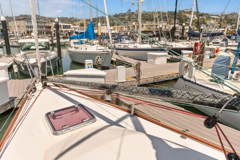 Slide: The Image of Sailboats docked at a marina, featuring a 2008 Sabre Spirit in the foreground. - 43