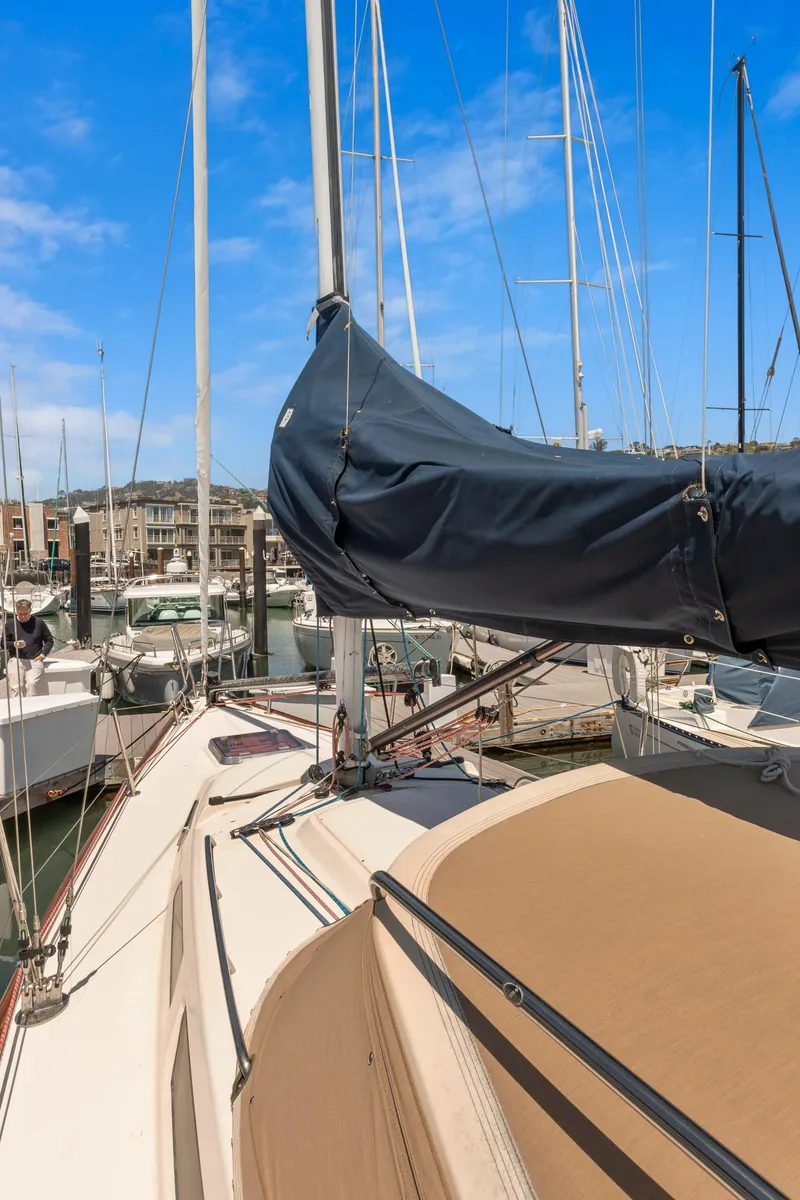 Slide: The Image of 2008 Sabre Spirit sailboat docked in marina under clear blue sky. - 46