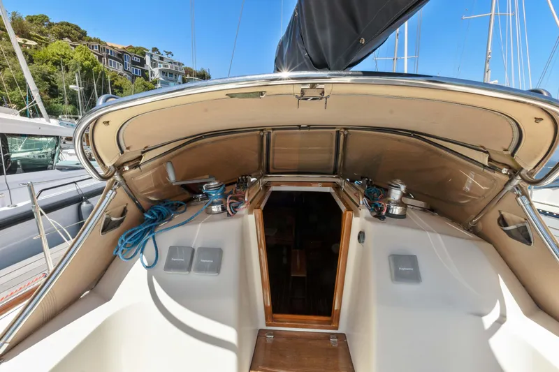 Slide: The Image of 2008 Sabre Spirit sailboat cockpit with open hatch, docked in marina. - 48