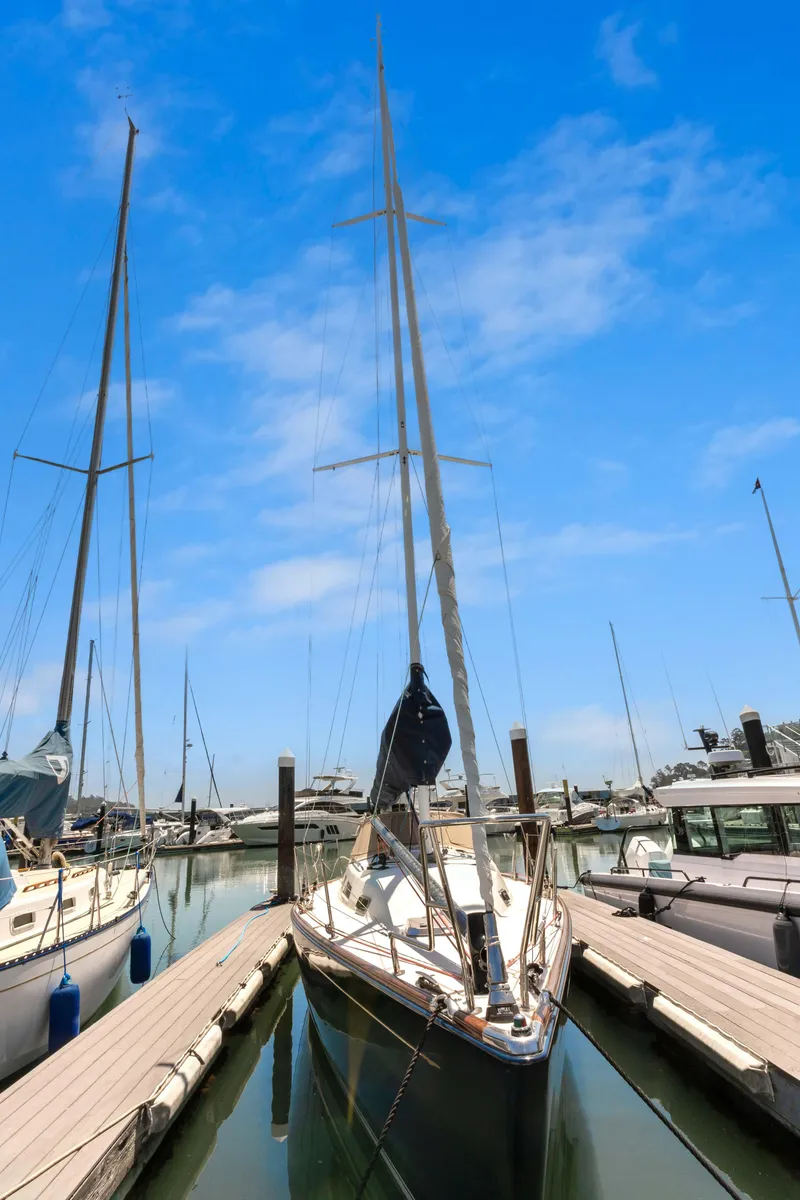 Slide: The Image of 2008 Sabre Spirit sailboat docked at marina under clear blue sky. - 49