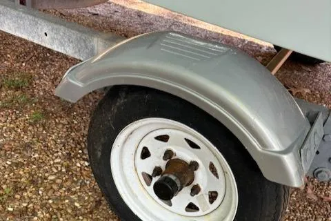 Slide: The Image of Trailer wheel and fender of 2013 Key Largo 160 Center Console boat. - 13