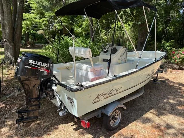 Slide: The Image of 2013 Key Largo 160 Center Console boat with Suzuki outboard motor on trailer. - 4