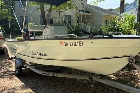 Slide: The Image of 2013 Key Largo 160 Center Console boat on trailer, named "Last Dance." - 5