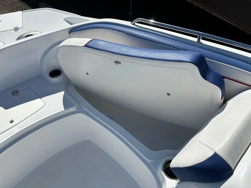 Slide: The Image of 2020 Tahoe 215 Xi boat interior with white and blue seating. - 10