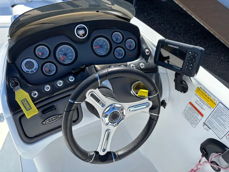 Slide: The Image of Steering console of 2020 Tahoe 215 Xi boat with gauges and navigation system. - 11