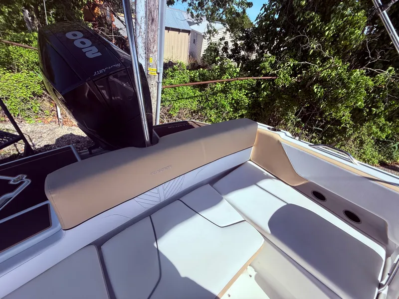 Slide: The Image of 2022 Glastron/Carlson GTD 220 boat interior with seating and outboard motor. - 12