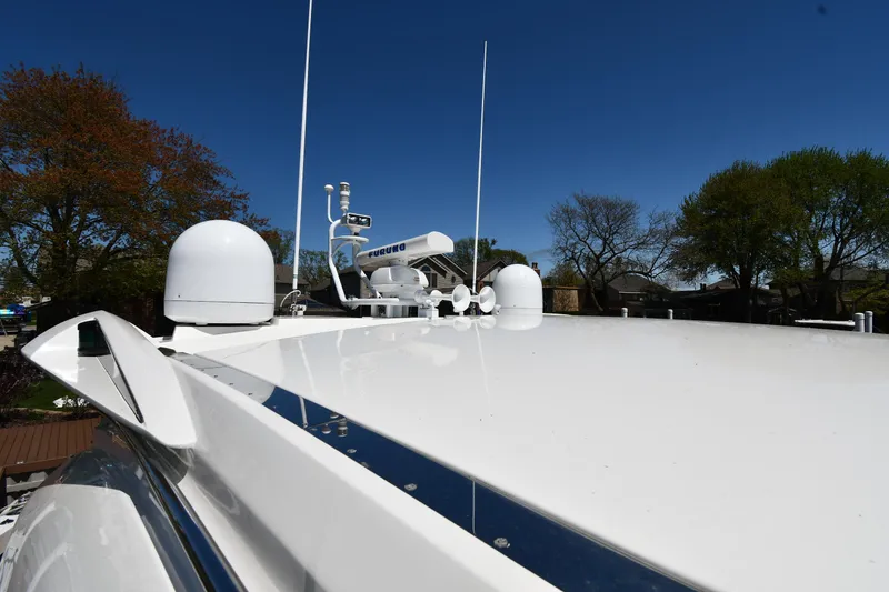 Slide: The Image of Sunseeker 68 Predator 2002 yacht roof with antennas and clear blue sky. - 12