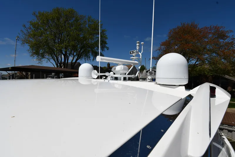 Slide: The Image of Sunseeker 68 Predator 2002 yacht roof with antennas and clear blue sky. - 13