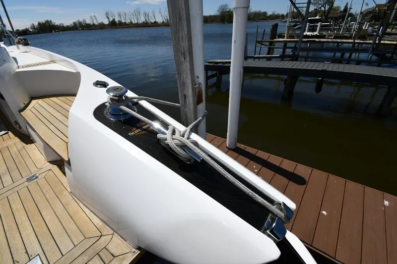 Slide: The Image of Sunseeker 68 Predator 2002 yacht docked, showcasing sleek design and mooring details. - 16