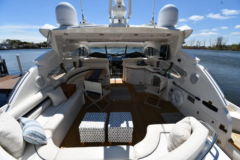 Slide: The Image of Luxurious 2002 Sunseeker 68 Predator yacht interior with elegant seating and modern amenities. - 18