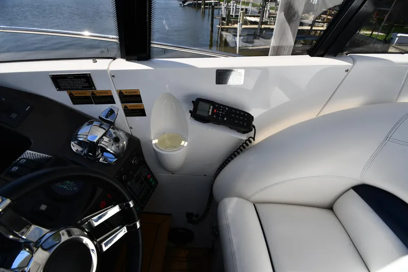 Slide: The Image of Interior view of 2002 Sunseeker 68 Predator yacht cockpit with steering wheel and controls. - 25
