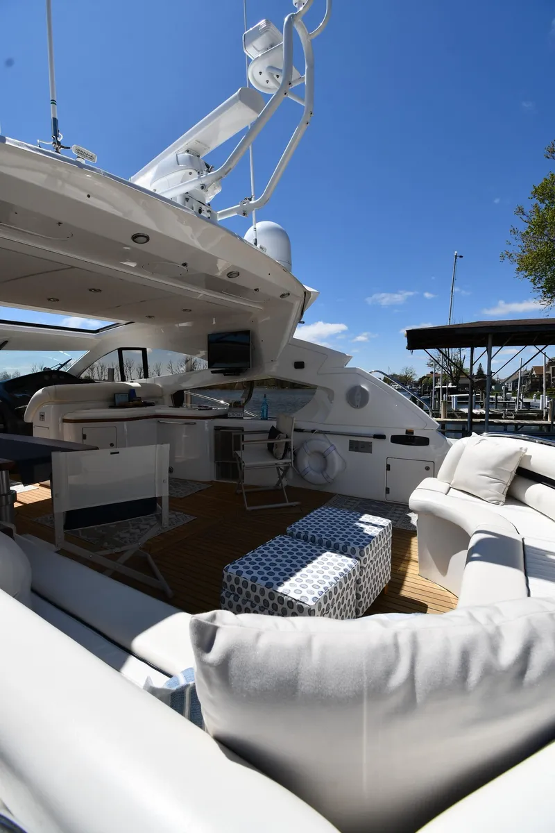 Slide: The Image of Luxurious 2002 Sunseeker 68 Predator yacht with spacious outdoor seating and modern amenities. - 31