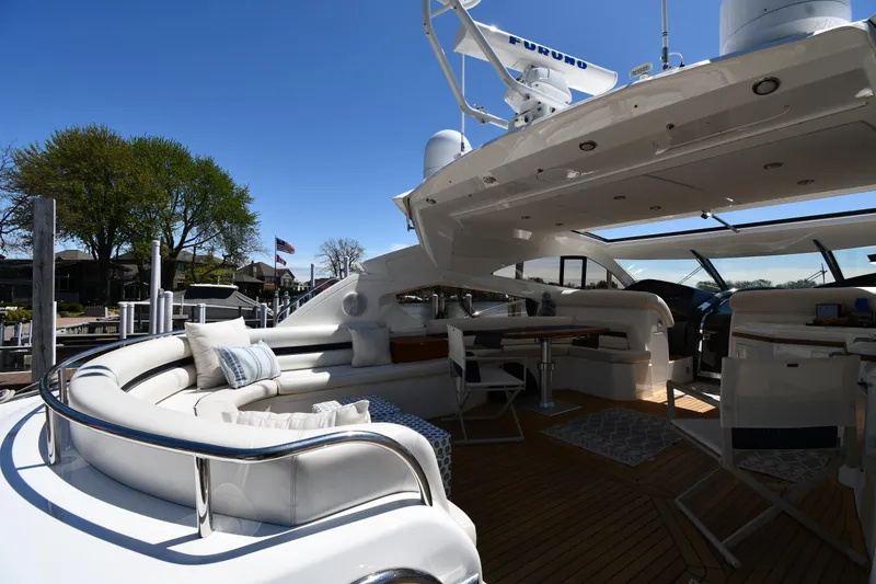 Slide: The Image of Luxurious 2002 Sunseeker 68 Predator yacht with spacious outdoor seating and elegant design. - 32