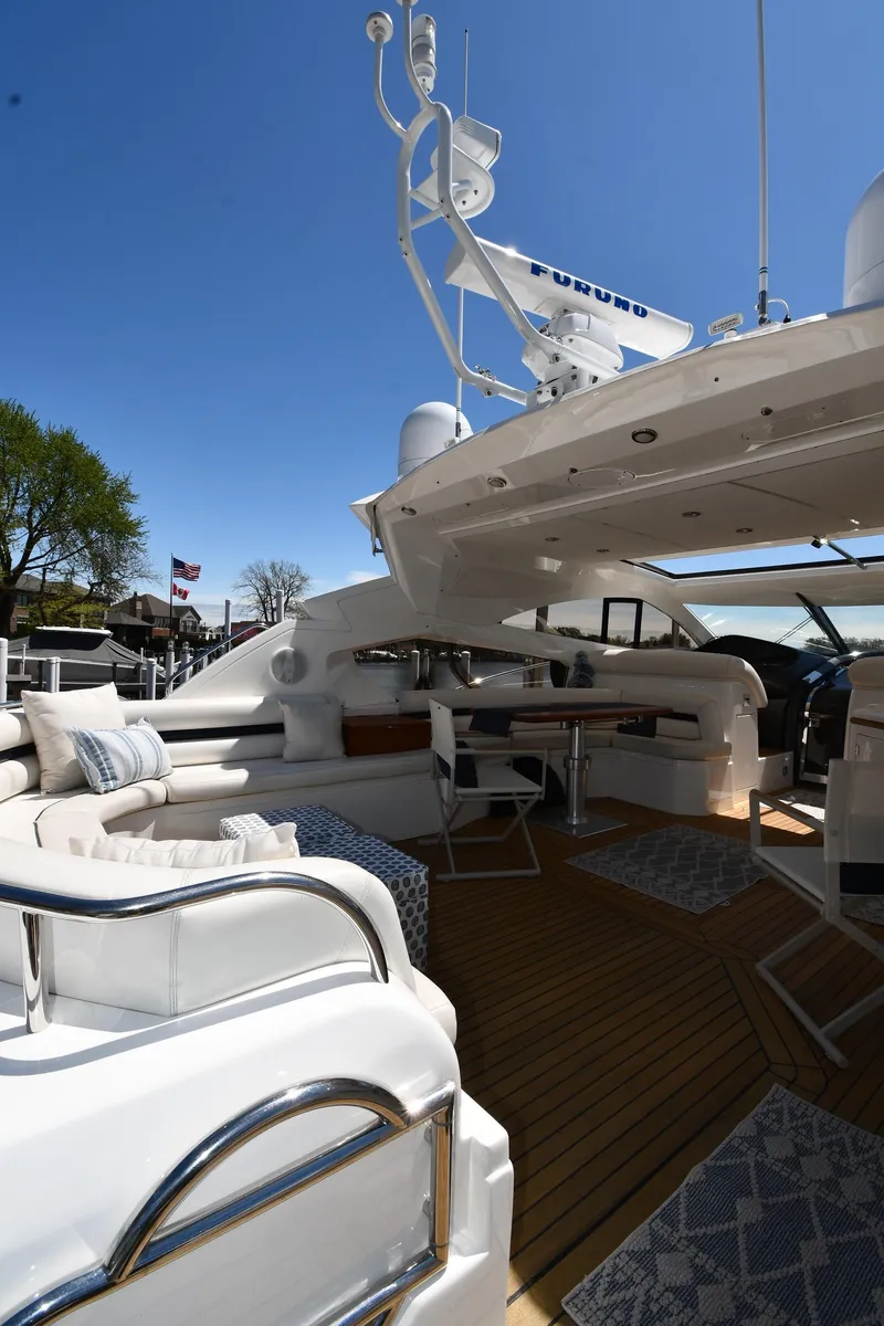 Slide: The Image of Luxurious 2002 Sunseeker 68 Predator yacht with spacious deck and elegant seating area. - 33