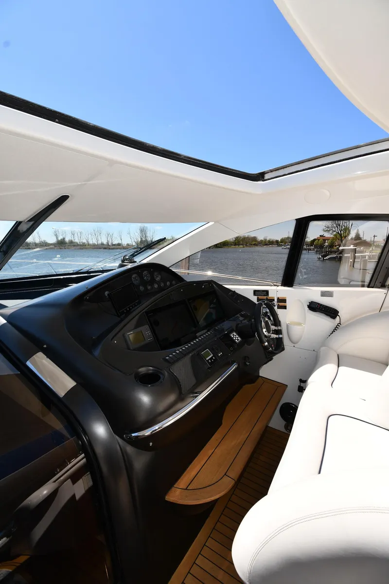 Slide: The Image of Interior view of 2002 Sunseeker 68 Predator yacht cockpit with modern controls. - 37