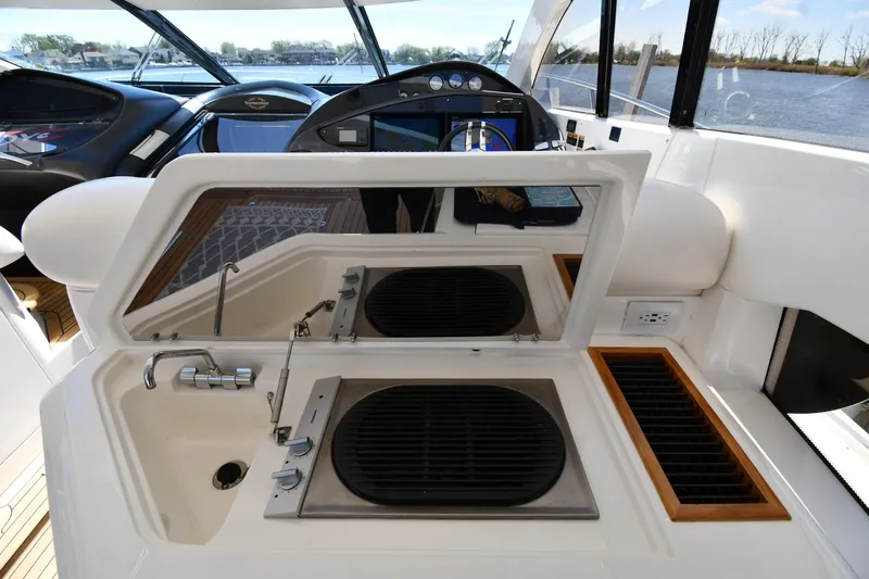 Slide: The Image of Sunseeker 68 Predator 2002 yacht interior with sink and grill station. - 38