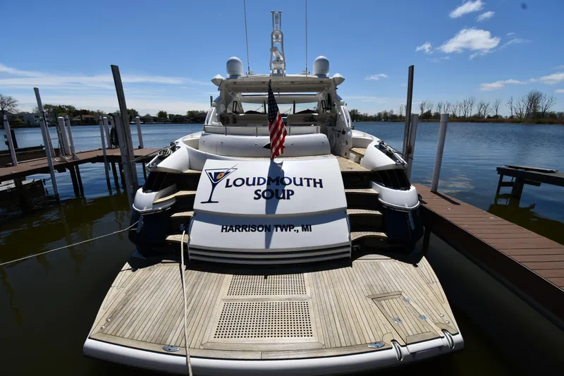 Slide: The Image of Sunseeker 68 Predator yacht docked, rear view, with "Loudmouth Soup" name, Harrison Twp, MI. - 4